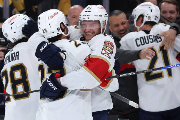Anton Lundell of the Florida Panthers and Carter Verhaeghe celebrate after the Panthers defeat the Boston Bruins 4-3 in overtime of Game Seven of the...