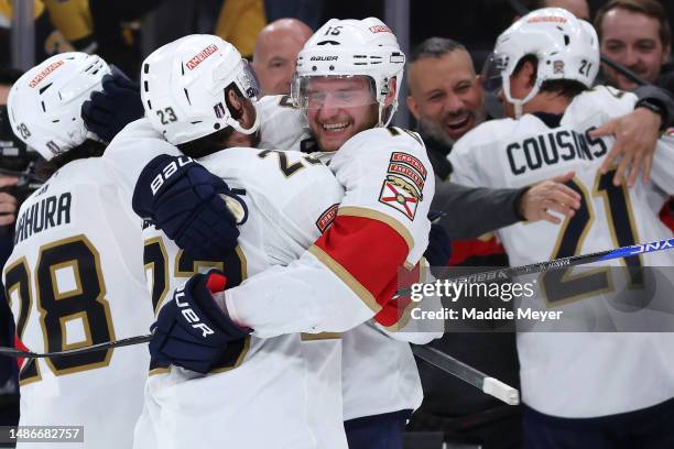 Anton Lundell of the Florida Panthers and Carter Verhaeghe celebrate after the Panthers defeat the Boston Bruins 4-3 in overtime of Game Seven of the...