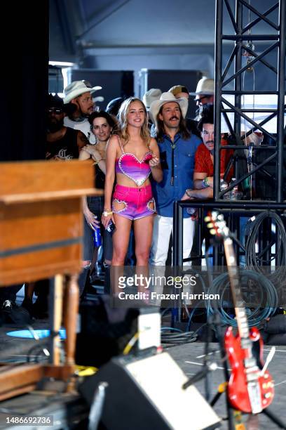 Hassie Harrison is seen while Ryan Bingham performs onstage during Day 3 of the 2023 Stagecoach Festival on April 30, 2023 in Indio, California.