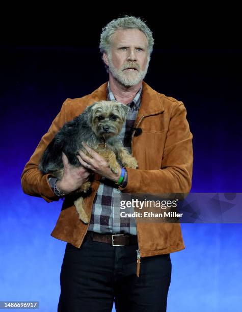 Will Ferrell holds canine cast member Sophie as he speaks onstage to promote the upcoming film "Strays" during the Universal Pictures and Focus...