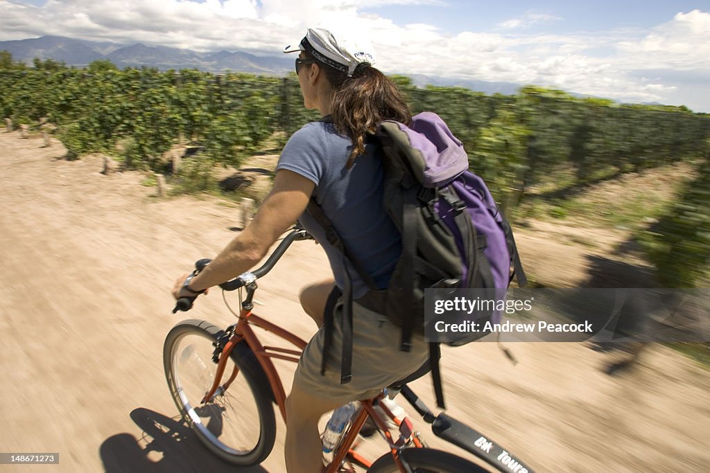 A wine cycling tour particapant on her bike.