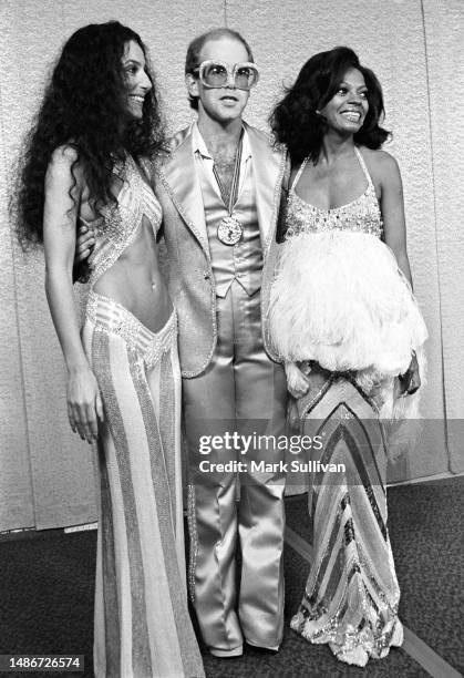 Actress/Singer Cher, Singer/Songwriter/Musician Elton John and Actress/Singer Diana Ross pose on the red carpet during the Rock Awards at the Santa...