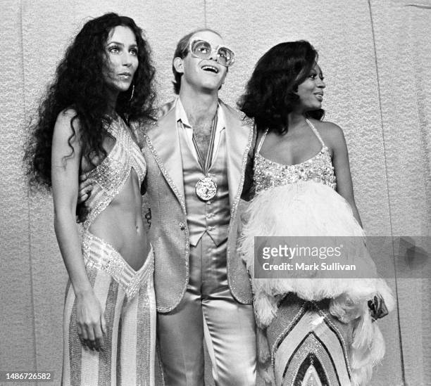 Actress/Singer Cher, Singer/Songwriter/Musician Elton John and Actress/Singer Diana Ross pose on the red carpet during the Rock Awards at the Santa...
