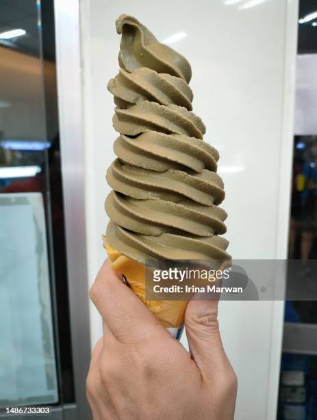 eating ice cream - yogurt swirl stock pictures, royalty-free photos & images