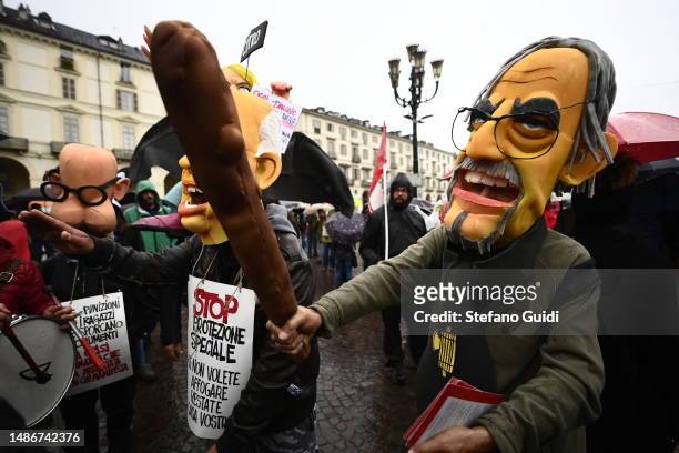 Person dressed in a costume in the likes of Italian President of the Senate, Ignazio La Russa, attends a May Day rally on May 1, 2023 in Turin,...