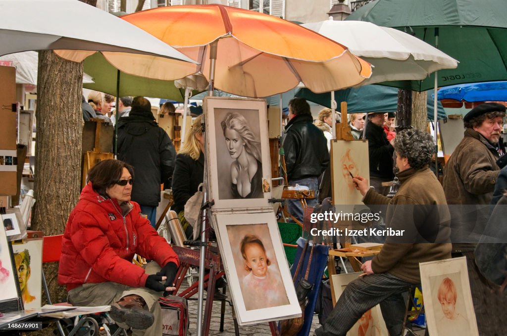 Street artists painting at Place du Tertre.