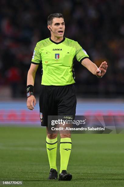 Referee Simone Sozza gestures during the Serie A match between Bologna FC and Juventus at Stadio Renato Dall'Ara on April 30, 2023 in Bologna, Italy.