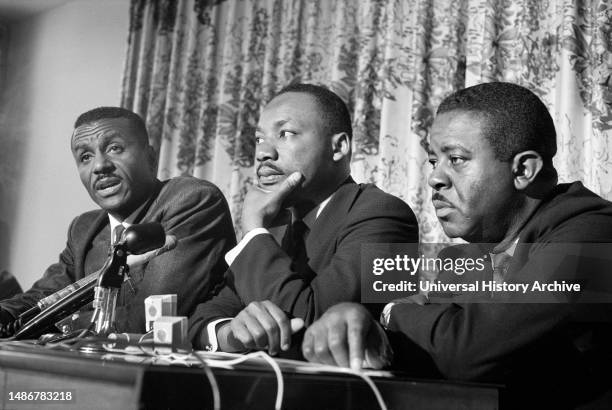 Civil rights leaders Fred Shuttlesworth, Martin Luther King and Ralph Abernathy at press conference during Birmingham Campaign, Birmingham, Alabama,...