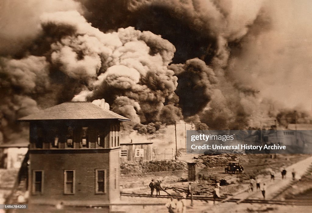Buildings burning during Race Riots, Greenwood District, Tulsa, Oklahoma, USA, Unidentified Artist, June 1921
