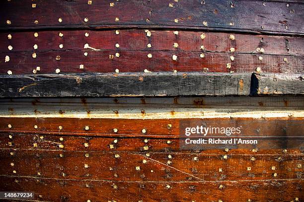detail of ship hull at dhow wharfage on dubai creek. - ship hull stock pictures, royalty-free photos & images