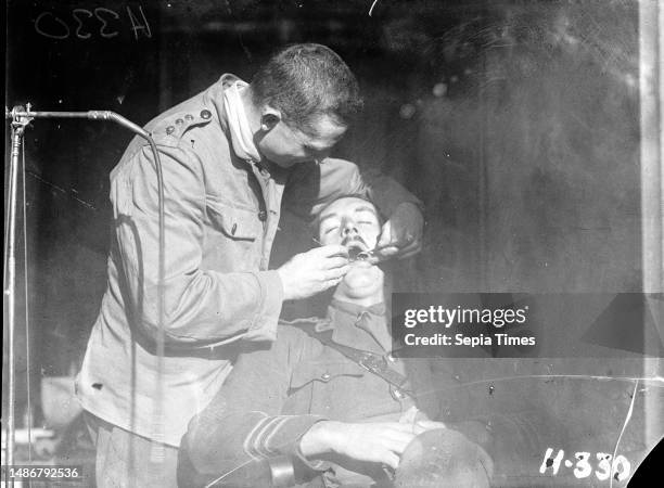 New Zealand Dental Corps dentist carrying out an inspection during World War I, A dentist from the New Zealand Dental Corps carrying out a dental...