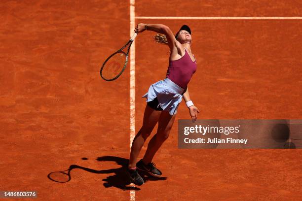 Mirra Andreeva serves against Aryna Sabalenka during their Women's fourth round match on Day Eight of the Mutua Madrid Open at La Caja Magica on May...