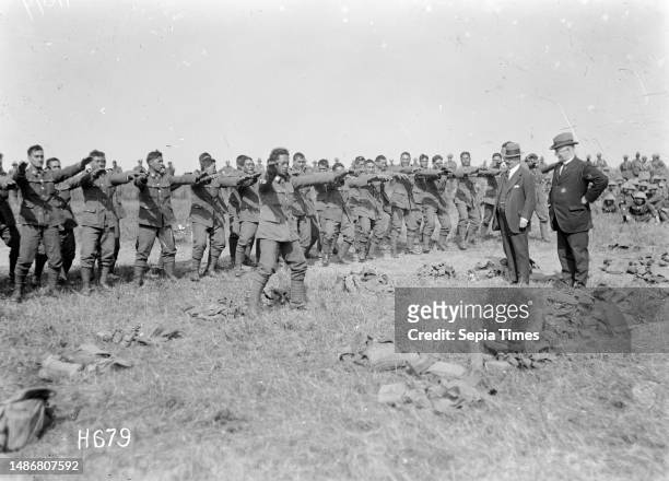 Members of the Pioneer Battalion performing a haka for ministers Massey and Ward, Bois-de-Warnimont, France, Members of the Maori `Pioneer Battalion'...