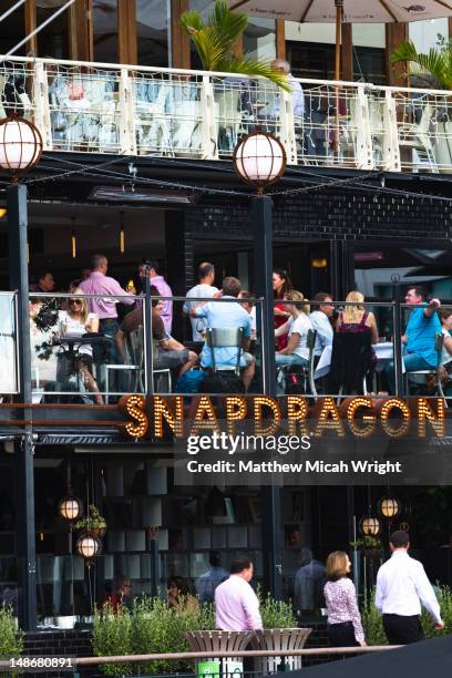 restaurants crowd the touristy viaduct harbor in downtown auckland - viaduct stock pictures, royalty-free photos & images