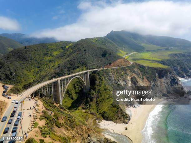 bixby bridge with pacific coast highway 1 road is a scenic road that stretches along the california coast from dana point in orange county to leggett in mendocino county in california, usa. - monterey peninsula stock-fotos und bilder