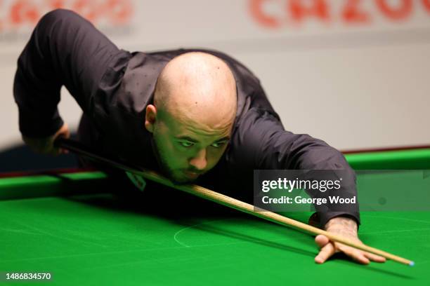 Luca Brecel of Belgium plays a shot during their Final match against Mark Selby of England on Day Sixteen of the Cazoo World Snooker Championship...