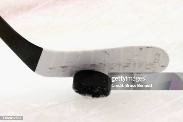 Graphic shot of a hockey stick and puck as shot during warm-ups prior to the game between the New York Rangers and the New Jersey Devils in Game Six...