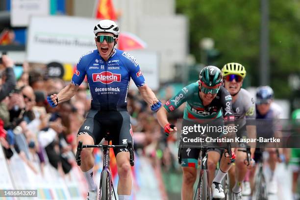 Søren Kragh Andersen of Denmark and Team Alpecin-Deceuninck celebrates at finish line as race winner ahead of Patrick Konrad of Austria and Team...