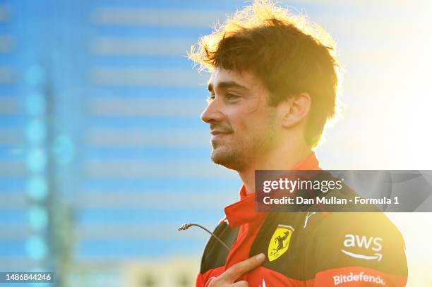 Pole position qualifier Charles Leclerc of Monaco and Ferrari celebrates in parc ferme during qualifying ahead of the F1 Grand Prix of Azerbaijan at...