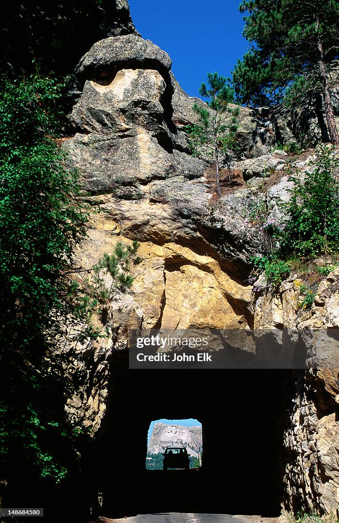 Iron Mountain road tunnel with Mt Rushmore in background.