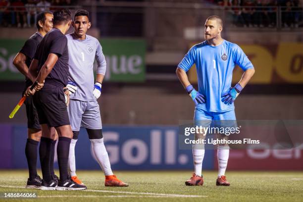 goalies from both professional soccer teams stand and listen to referees before important game - soccer competition stock pictures, royalty-free photos & images