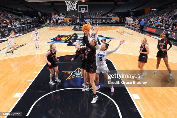 Emilie Teall of Transylvania Pioneers rebounds against the Christopher Newport Captains during the Division III Women’s Basketball Championship held...