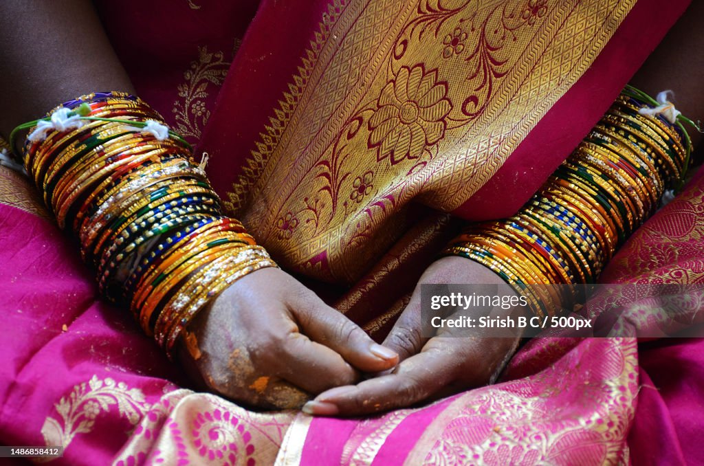 Midsection of bride wearing sari and sari,Mahabalipuram,Tamil Nadu,India