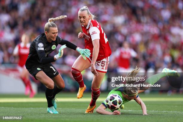 Stina Blackstenius of Arsenal is challenged by Merle Frohms and Kathrin Hendrich of VfL Wolfsburg, before going on to score the teams first goal,...