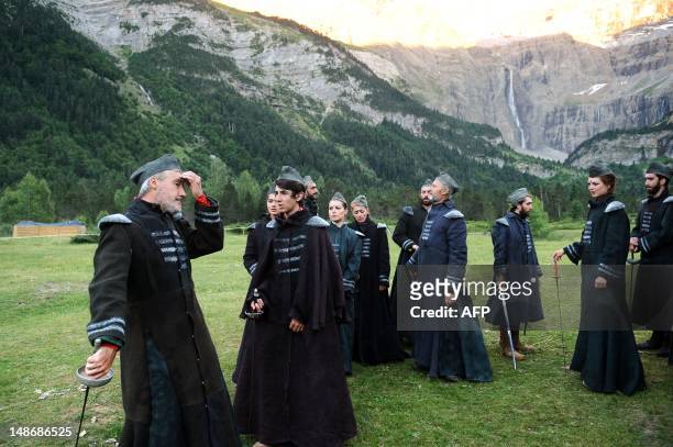 Actors wait before performing in the play "Le Cid" written by Pierre Corneille, on July 17, 2012 in the Gavarnie cirque, a UNESCO World Heritage...