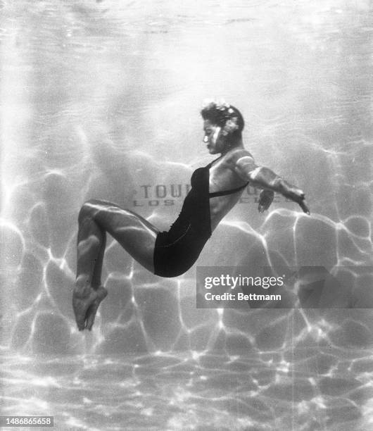 Esther Williams performs an interpretive dance in the pool at Town House in Los Angeles.