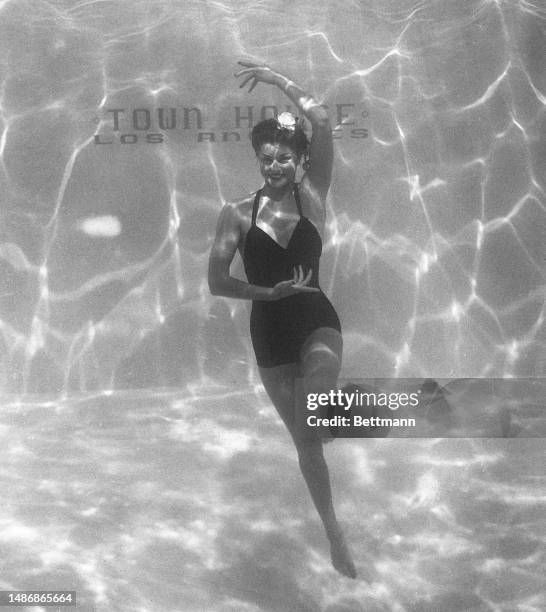 Esther Williams performs an interpretive dance in the pool at Town House in Los Angeles.