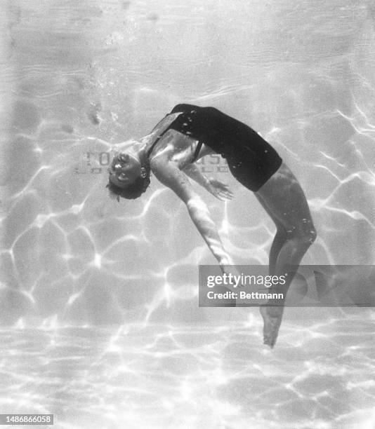 Esther Williams performs an interpretive dance in the pool at Town House in Los Angeles.