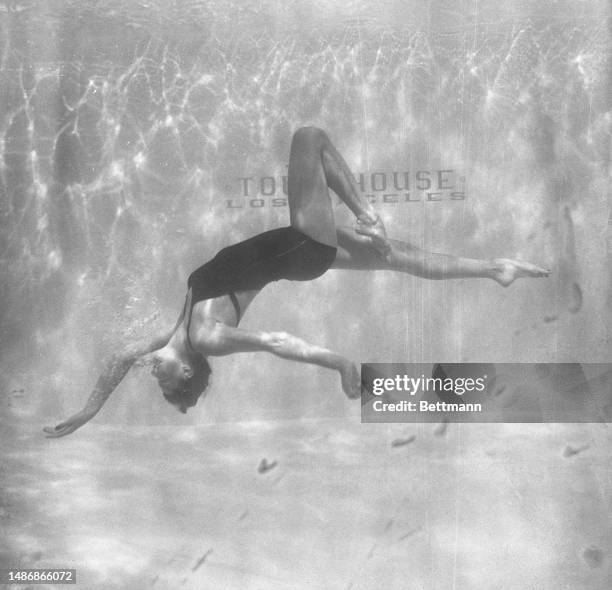 Esther Williams performs an interpretive dance in the pool at Town House in Los Angeles.