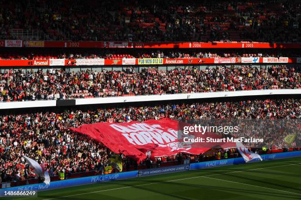 General view of the inside of the stadium as fans raise a Banner which reads "Always Forward" prior to the UEFA Women's Champions League semi-final...