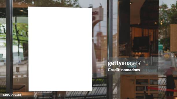 blank poster on window glass template. empty placard attached on window glass. billboard and various business promotions for retail stores and restaurants. - montra imagens e fotografias de stock