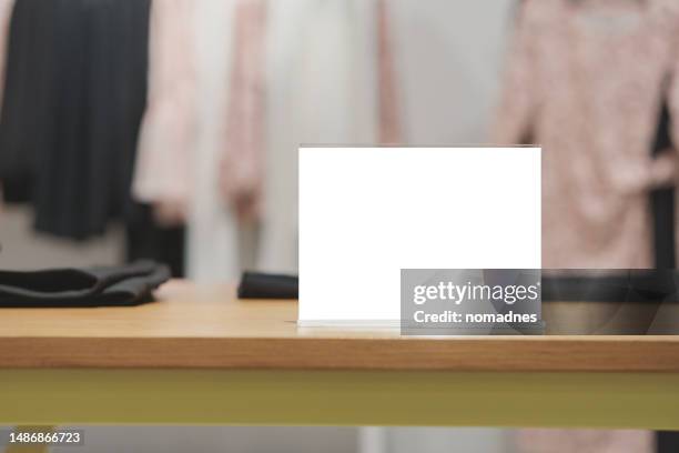 blank sign holder in retail stores. empty placard and brochure on sign holder stand. various business promotions for retail stores and modern business. - poster mockup stock pictures, royalty-free photos & images