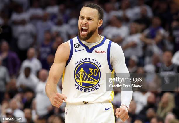 Stephen Curry of the Golden State Warriors celebrates during the third quarter in game seven of the Western Conference First Round Playoffs against...