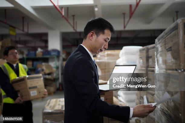 warehouse staff use laptops to record - bank check processing stock pictures, royalty-free photos & images