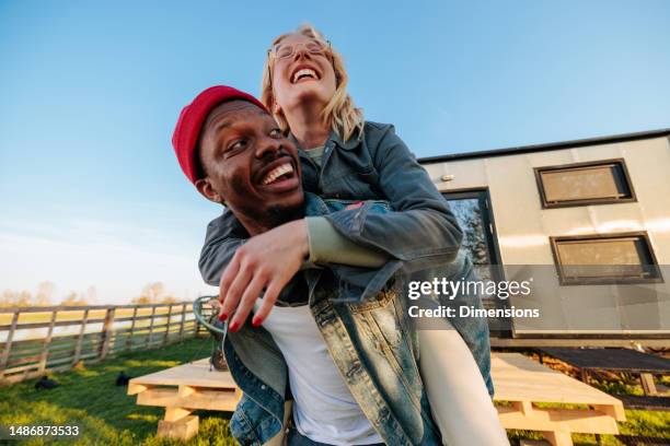cheerful couple having fun. - wide angle stock pictures, royalty-free photos & images