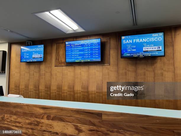 Flight status screens at Kahului International Airport on Maui, Kahului, Hawaii, August, 2022. Photo courtesy Sftm.