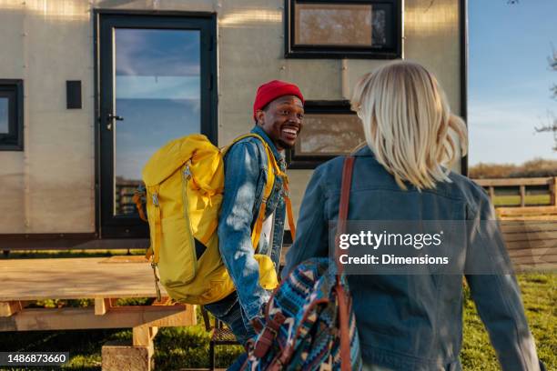 happy couple on weekend vacation. - backpacker apartment stock pictures, royalty-free photos & images