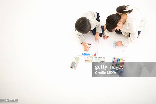 boy and girl drawing pictures - children drawing white background bildbanksfoton och bilder