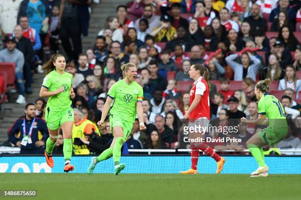 Alexandra Popp of VfL Wolfsburg celebrates after scoring the team's second goal with teammates during the UEFA Women's Champions League semi-final...