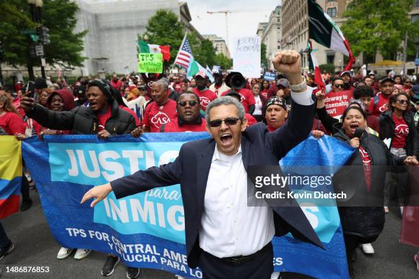 Gustavo Torres , Executive Director of CASA, an immigrants rights and outreach organization, marches with fellow activists during a rally for migrant...