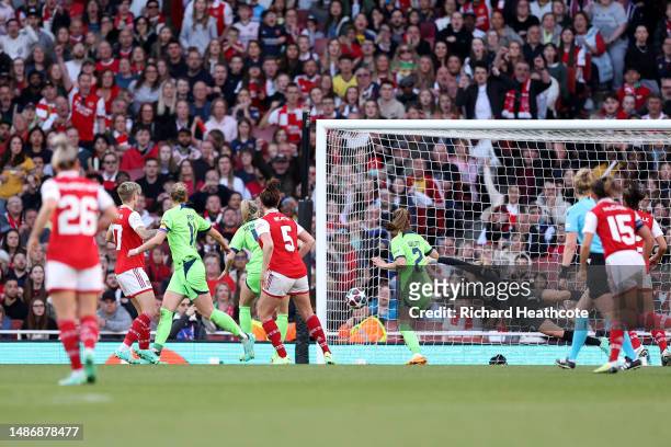 Jennifer Beattie of Arsenal scores the team's second goal as Merle Frohms of VfL Wolfsburg fails to make a save during the UEFA Women's Champions...