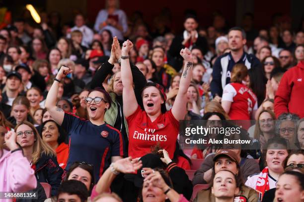 Fans of Arsenal react during the UEFA Women's Champions League semi-final 2nd leg match between Arsenal and VfL Wolfsburg at Emirates Stadium on May...