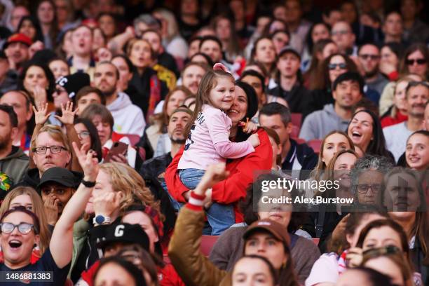 Fans of Arsenal react during the UEFA Women's Champions League semi-final 2nd leg match between Arsenal and VfL Wolfsburg at Emirates Stadium on May...