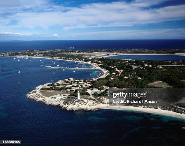 aerial of rottnest island over the bathurst lighthouse, circa 1900, and thomson bay. - rottnest island stock pictures, royalty-free photos & images