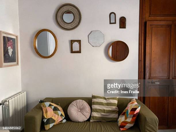 mirrors placed randomly on the wall of the hall of the house - feng shui house stock pictures, royalty-free photos & images