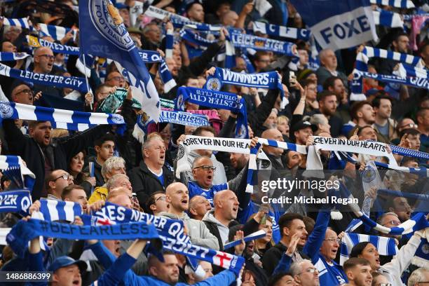 Leicester City fans hold their scarfs aloft during the Premier League match between Leicester City and Everton FC at The King Power Stadium on May...